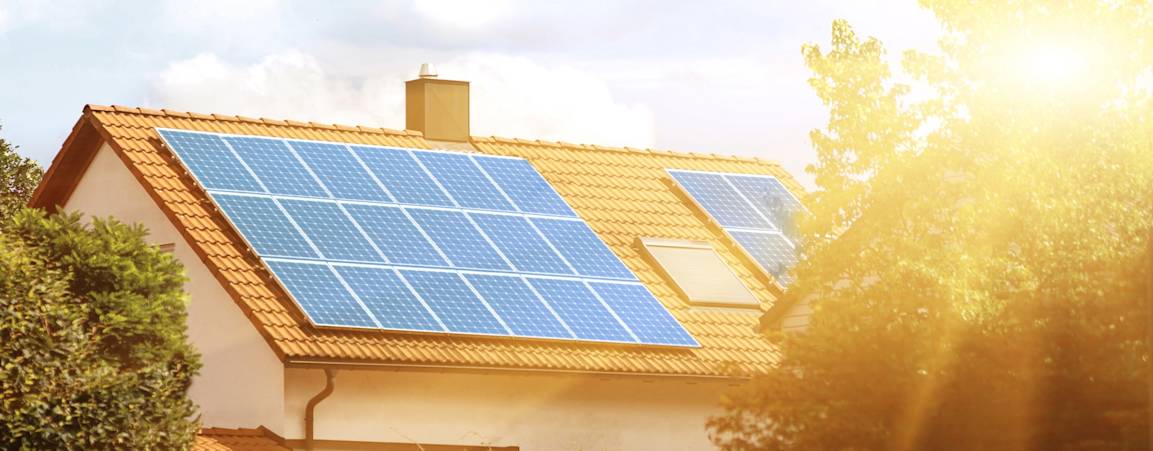 Solar panels on a home in a neighborhood