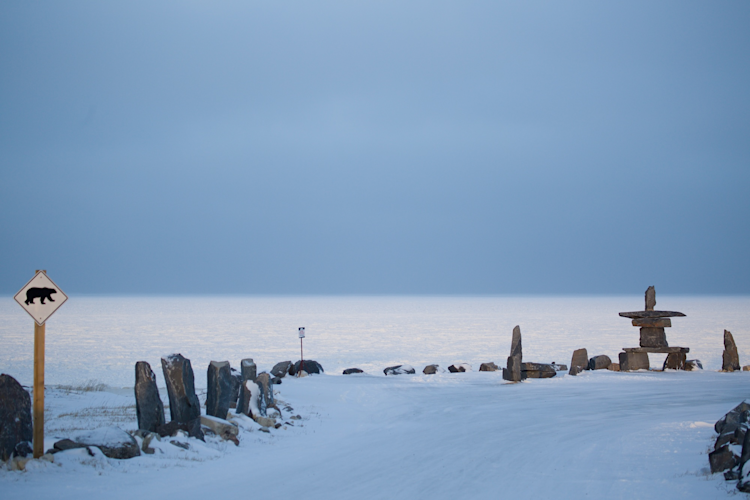 Churchill Inukshuk with Polar Bear Sign Near Beach